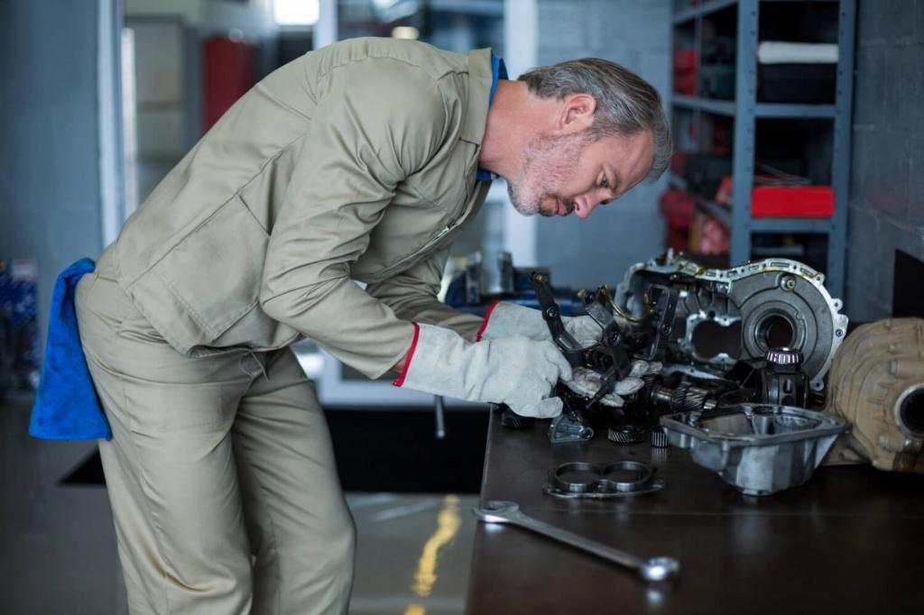 mechanic-checking-car-parts.jpg