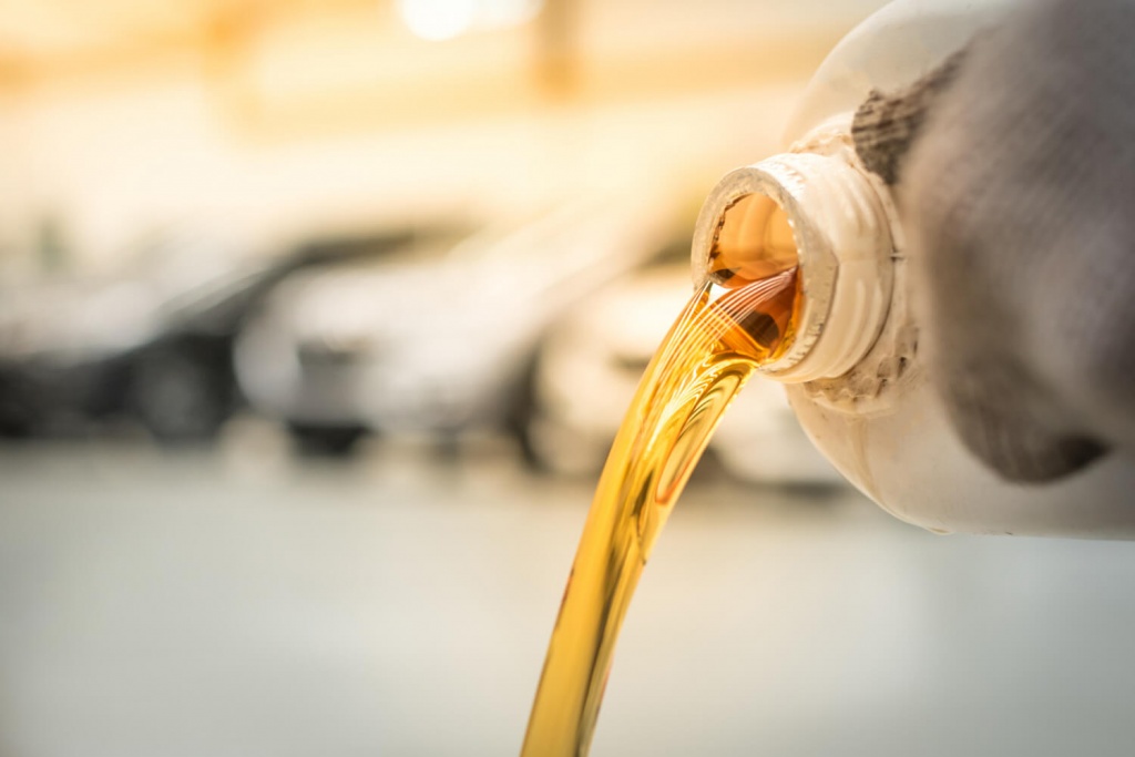 pouring-engine-oil-into-engine-room-gold-oil-during-car-oil-change-repair-shop-service-center-interior-car-care-center.jpg pouring-engine-oil-into-engine-room-gold-oil-during-car-oil-change-repair-shop-service-center-interior-car-care-center.jpg