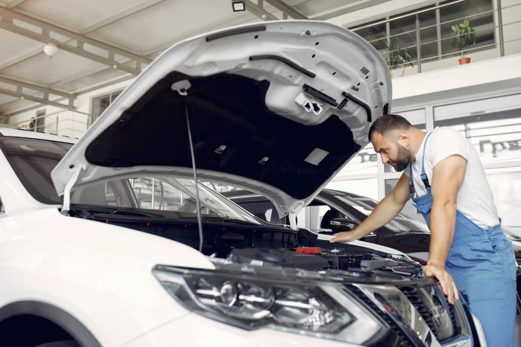 handsome-man-blue-uniform-checks-car.jpg