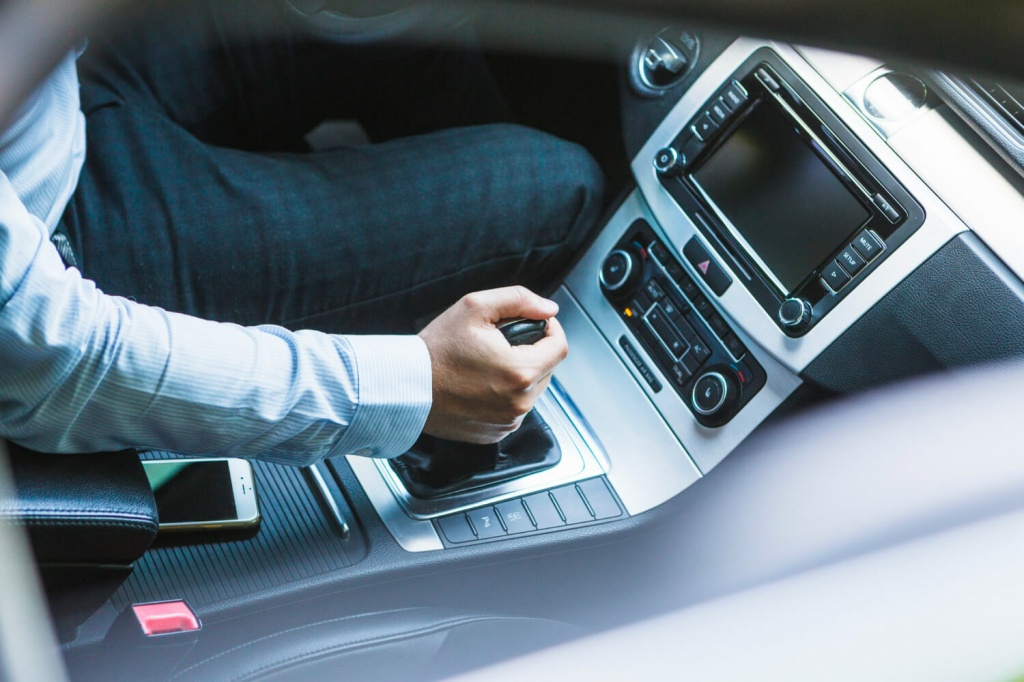 high-angle-view-man-s-hand-changing-gear-car.jpg high-angle-view-man-s-hand-changing-gear-car.jpg