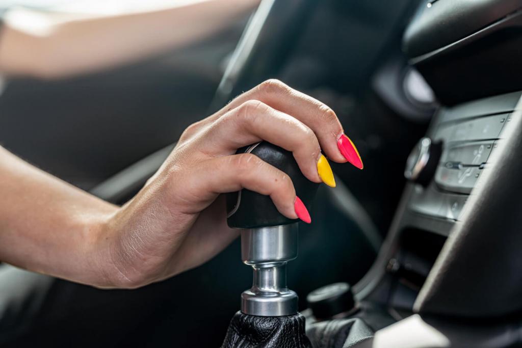 female-driver-hand-shifting-gear-shift-knob-manually-before-beginning-ride.jpg